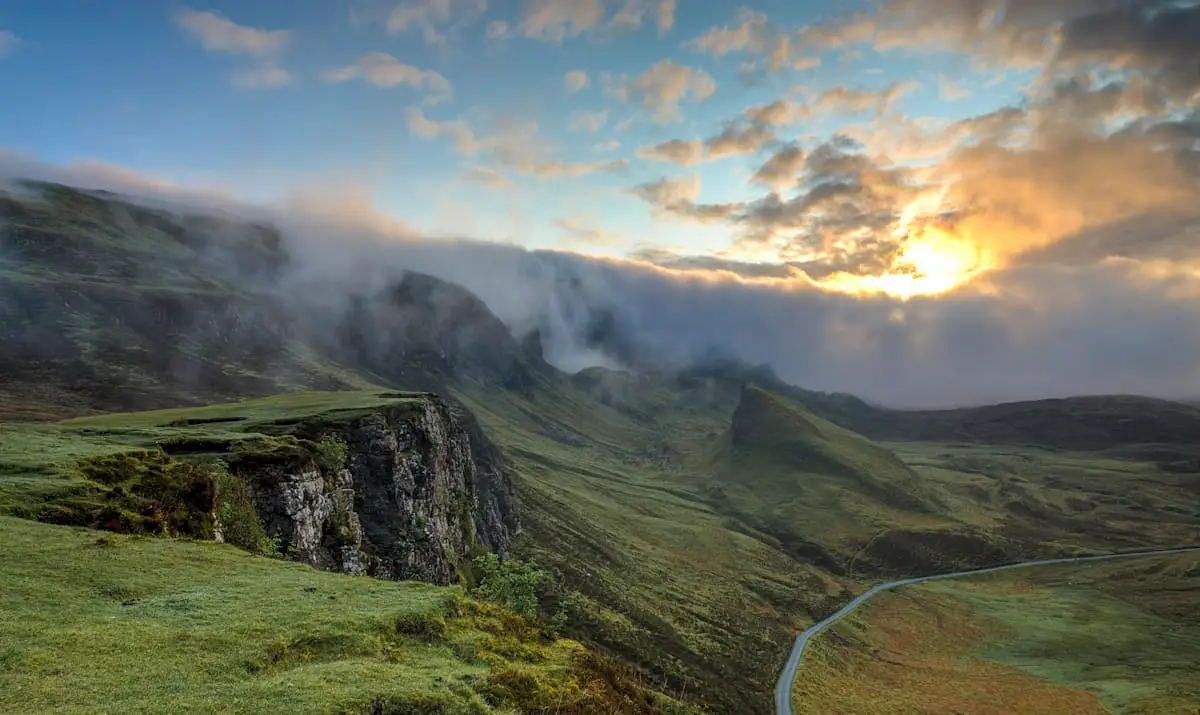 Green mountain valley at sunrise