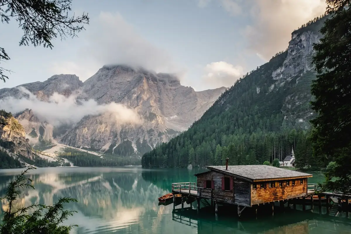 Alpine lake beside mountain lodge