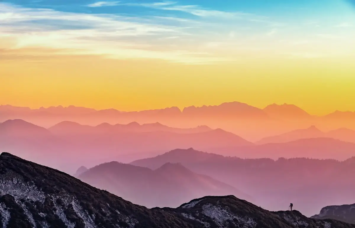 Layered mountain ridges at sunset
